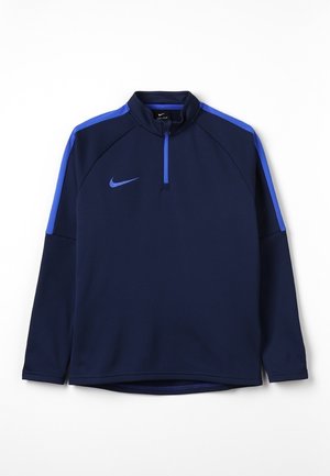 Sweat-shirt léger bleu marine Nike avec une fermeture éclair quart, présentant des accents bleus sur les épaules et un petit logo sur la poitrine.