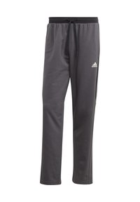 Pantaloni sportivi grigi in tessuto morbido, con vita regolabile tramite cordoncino, logo bianco Adidas sulla coscia sinistra e tasche laterali.