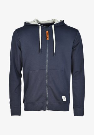 Granatowy hoodie na zamek, wykonany z mieszanki bawełny, z szarym podszyciem kaptura, dwiema przednimi kieszeniami oraz sznurkiem do regulacji w pomarańczowym kolorze.