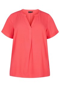 Haut à manches courtes corail avec un col en V, présentant une coupe ample et un tissu doux. Comprend un pli central et des poignets repliés pour plus de détails.