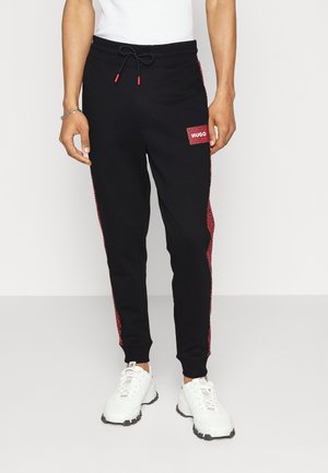 DACINO - Tracksuit bottoms - black