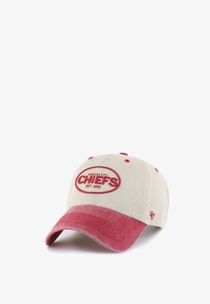 Beige and red Kansas City Chiefs baseball cap with red embroidered logo and text "Est. 1960" on front panel.
