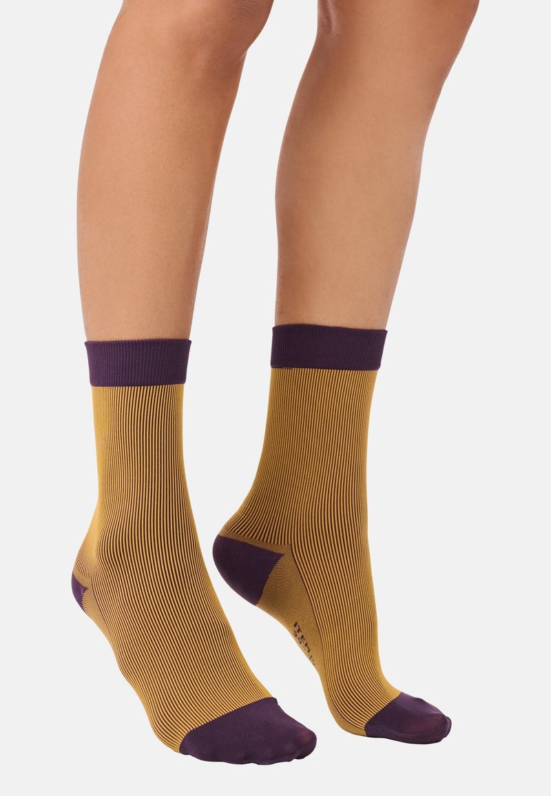 Yellow and purple striped ankle socks with a ribbed texture, featuring solid purple cuffs and toe accents. Designed for a snug fit.