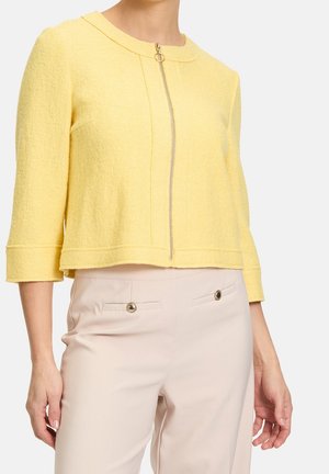 Välikausitakki - yellow