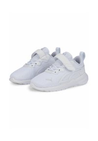 White sneakers with a mesh upper, lace and Velcro closures, padded ankle support, and a textured sole. Features logo on the side.