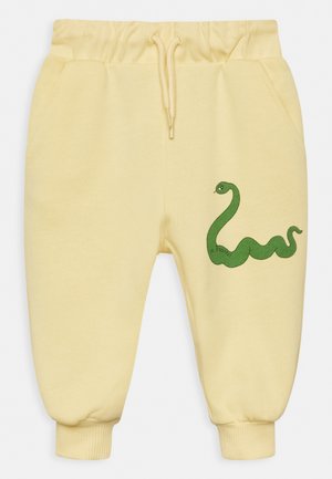 SNAKE UNISEX - Tracksuit bottoms - yellow