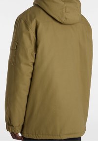 Olive green hooded jacket with a relaxed fit, elastic cuffs, and a side pocket. Features a smooth texture and durable fabric.