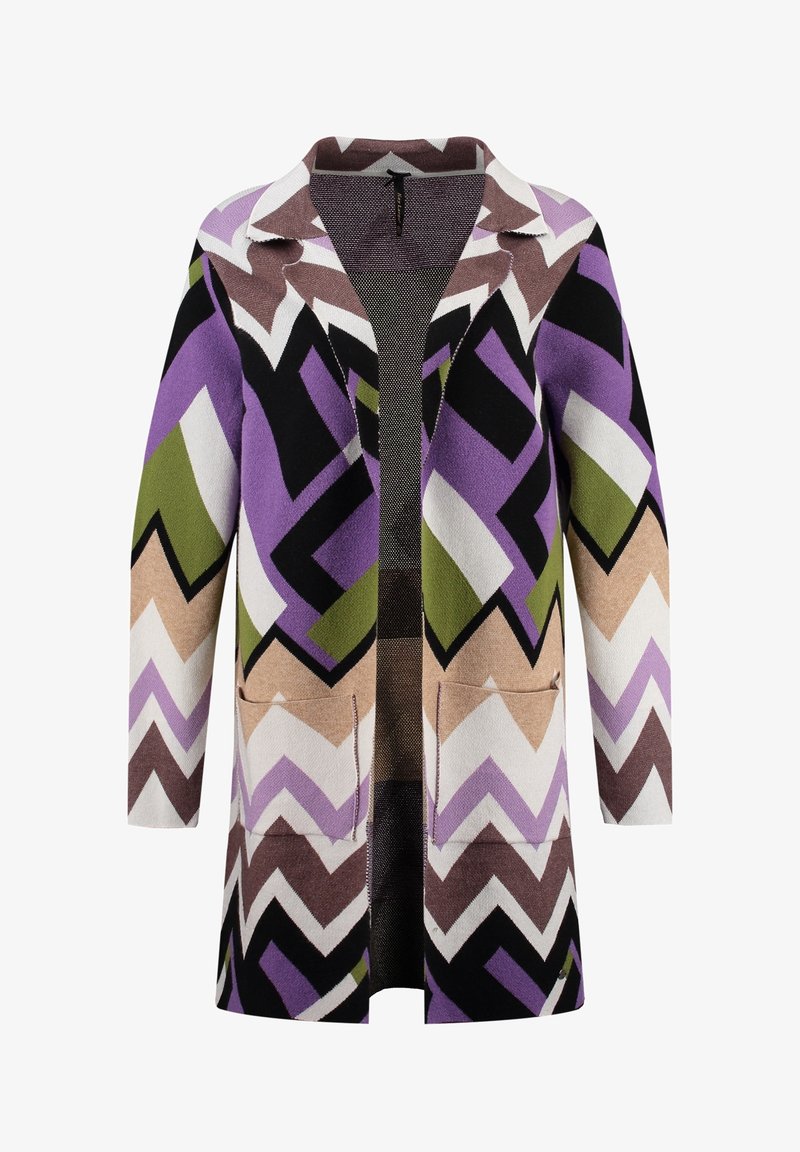 Long cardigan en tissu doux avec un motif en zigzag dans des teintes de violet, noir, marron, vert et beige. Équipé de deux poches avant.
