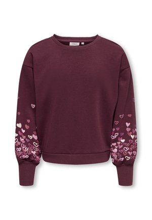 Sweat-shirt bordeaux avec de longues manches bouffantes, décoré de grappes de petits cœurs roses et blancs près des poignets.