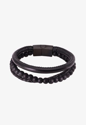 Zwarte armband met twee getextureerde banden: een gevlochten lederen band en een band met matte zwarte kralen. Voorzien van een magnetische sluiting.