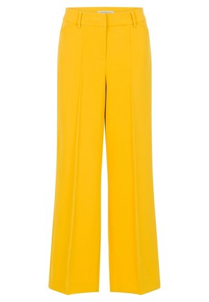 Pantalon large jaune vif avec plis devant, passants pour ceinture et fermeture frontale dissimulée.