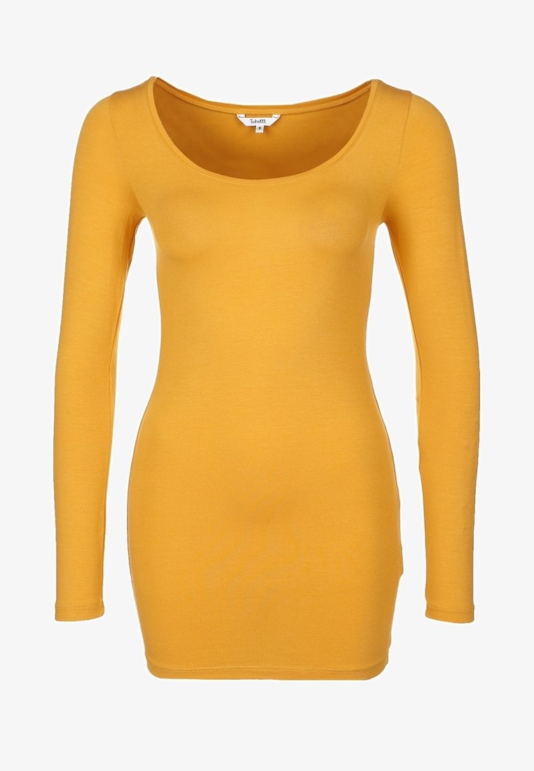 Długo rękawowy, dopasowany top w intensywnym żółtym kolorze. Posiada okrągły dekolt i jest wykonany z miękkiego, elastycznego materiału. Gładka, czysta faktura.