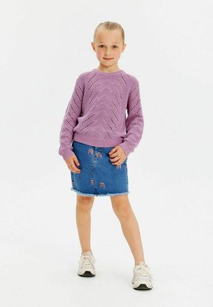 Light purple knitted sweater with a wave pattern, paired with a blue denim skirt featuring rainbow embroidery and frayed hem. White sneakers.
