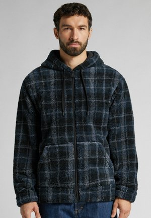 Samtige schwarz-blaue Karomuster Zip-Hoodie mit Kapuze, Fronttaschen und Kordelzug-Details; weicher Stoff und lockere Passform.