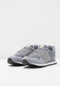 New Balance GW500 - Joggesko - grey/gold
