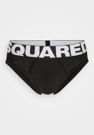 Schwarze Pants mit einem weißen elastischen Bund, auf dem "SQUARED" in fetten Buchstaben steht. Der Stoff ist glatt mit subtilen Texturdetails.