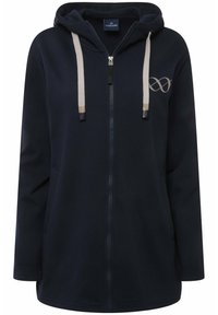Felpa con zip di colore navy, dotata di cappuccio con cordino, tasche frontali e un accento di logo discreto. Realizzata in un morbido tessuto testurizzato.