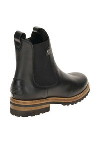 Black leather Chelsea boot featuring elastic side panels, a textured patch with branding, and a treaded rubber sole with a wooden accent.