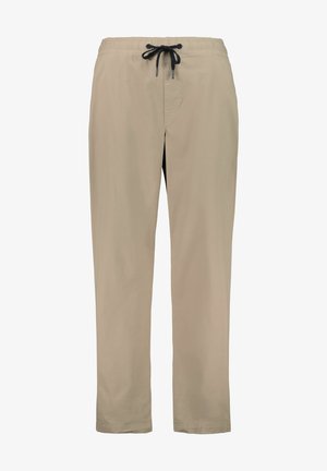Beżowe lekkie spodnie z elastycznym paskiem do regulacji. Prosty krój nogawki, bez wyraźnych wzorów czy akcentów, gładka tekstura.