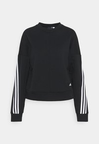 Felpa nera con maniche lunghe caratterizzata da tre strisce bianche su ciascun braccio, scollatura a girocollo e design cropped. Due tasche laterali visibili.