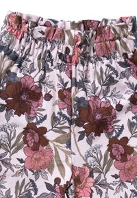 Floral-patterned fabric pants featuring a mix of pink, maroon, and green flowers on a light background; elastic waistband for comfort.
