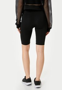 Koton SLIM FIT - Shorts - black