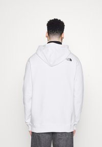 The North Face Mikina s kapucí - white