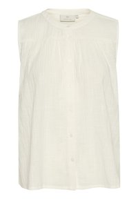 Blouse blanche sans manches en tissu texturé, dotée d'un col rond et d'une fermeture à boutons, avec une silhouette évasée et de subtils plis.