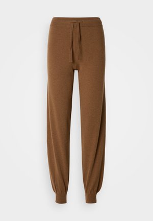 Braune, gestrickte Jogginghosen mit elastischem Bund, verstellbarem Kordelzug und schmal zulaufenden Bündchen. Weiche Textur und entspannter Schnitt.