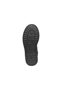 Suela de zapato de goma negra con patrones de textura, presenta diseños circulares y en cruz para mayor agarre, y un contorno de tacón curvado.