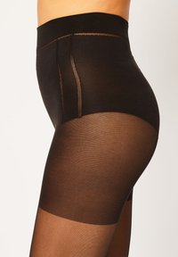 Collant neri con una vita alta. Presentano una finitura opaca liscia, una texture a contrasto e dettagli di cucitura sottili. Trasparenti sulla parte inferiore della gamba.