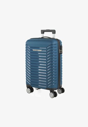 Maleta de mano de concha dura en azul oscuro, con textura estriada, mango retráctil y cuatro ruedas giratorias para una fácil maniobrabilidad.