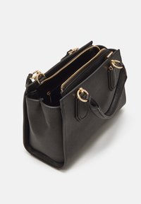 Black structured handbag made of textured material, featuring two zippered compartments, gold hardware, and dual handles for carrying.