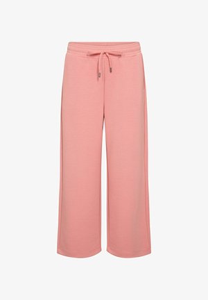 Pantaloni de trening largi, de culoare roz deschis, cu talie elastică, cordon de ajustare și textură de țesătură moale. Fără buzunare sau detalii suplimentare vizibile.