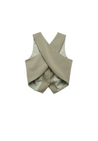 Gilet beige senza maniche con un design incrociato sovrapposto, realizzato in un tessuto liscio. Presenta un interno foderato di una tonalità più chiara.