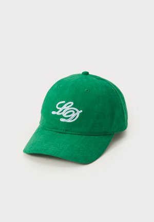 Green cotton baseball cap with a curved brim, featuring white embroidered lettering on the front and vent holes on the top.