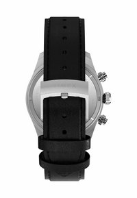 Black leather watch strap with multiple adjustable holes, stainless steel case, and visible hardware detailing. Back displays "TIMEX" logo.