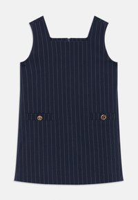 Rochie navy cu dungi verticale albe, decolteu pătrat, două buzunare frontale, accente din metal auriu, confecționată dintr-un material neted.