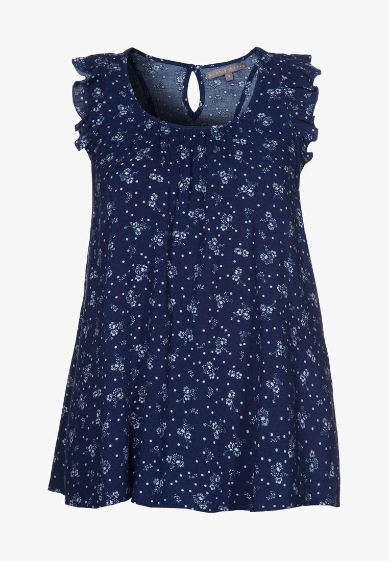 Blouse bleu marine à manches courtes avec motif floral blanc et à pois, manches volantées, col rond et fermeture à bouton avec œillet dans le dos.