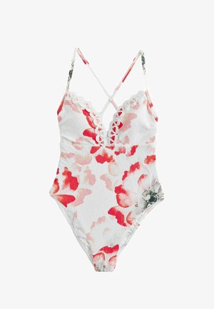 Hvid badedragt i ét stykke med røde og lyserøde blomsterprint, bølget udskæring og tynde krydsede skulderstropper.