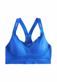 Sinine aktiivrinnahoidja, millel on sile tekstuur, polsterdatud tissid ja laiad õlapaelad, millel on logodetail. Disainis on tugiks racerback.