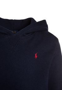 Navy hoodie made of soft cotton, featuring a front kangaroo pocket, drawstring hood, and a small red embroidered logo on the chest.