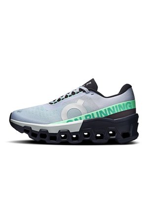 Helehall jooksujalats tekstuurse võrkkattega pealispinnaga, mustade detailide ja neoonrohelise brändinguga. Varustatud polsterdatud, jämeda tallaga toetuseks.