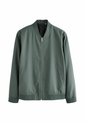 Veste bomber verte à zip avec col, poignets et ourlet côtelés, dotée de deux poches passepoilées à l'avant, présentée sur fond blanc.