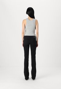 Marc O'Polo DENIM TROUSERS MID WAIST FLARED - Platėjantys džinsai - black