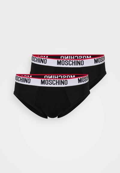 Culotte en coton noir avec une large ceinture élastique portant le nom de la marque "Moschino" en lettres blanches et rouges.