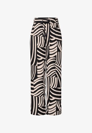 Pantalons larges noirs et crème avec une taille élastiquée, un détail de cordon de serrage, et un motif géométrique en vagues sur l'ensemble.