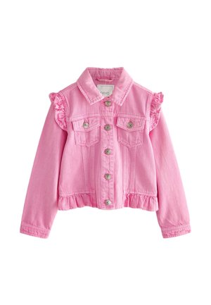 Lächelndes Mädchen trägt eine pinke Jacke über einem Einhorn-T-Shirt, einen funkelnden hellrosa Rock, weiße Socken und weiße High-Top-Sneaker.