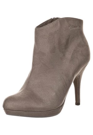 Haalea mokkanahka nilkkurit pyöreällä kärjellä, sivuvetoketjulla ja ohuella korkealla korolla.