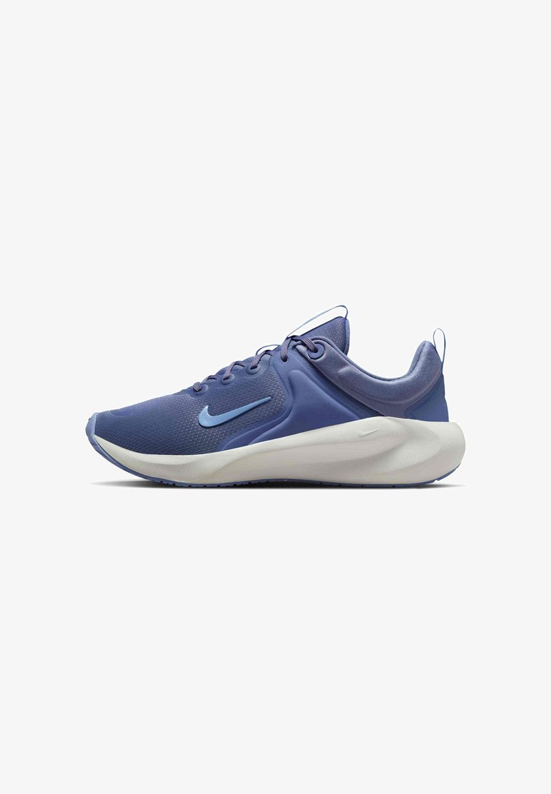 Zapatillas de correr Nike en azul oscuro con parte superior de malla, punta redondeada, acentos en azul claro y suela blanca acolchada.